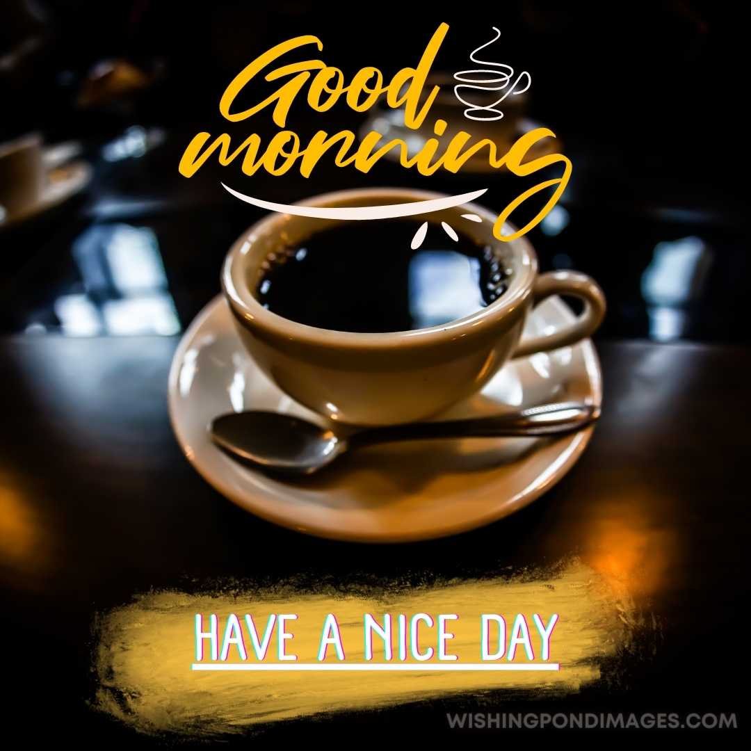 Black coffee image in plate with spoon on the dark brown-colored table. Good Morning Coffee Images